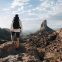 a man standing on top of a rocky mountain